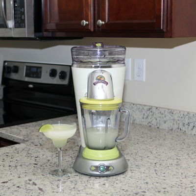 MARGARITAVILLE® Frozen Concoction Maker  - Keep the party flowing by serving up quality frozen concoctions with this unique, easy-to-use appliance. Far more than just an ordinary blender, the unit automatically shaves ice and blends up to 32 ounces of your favorite frosty drink, all at the touch of a button. Simply pour the ingredients into the glass jar, add ice and the machine does the rest. Features simple front-access controls, stable footprint, easy-to-clean design and a drip-free spout for graceful serving. One-year warranty included.
