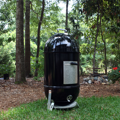WEBER® Smokey Mountain Cooker - There’s nothing better than slow-cooked barbecue! The smoker provides a spacious interior large enough to cook a whole turkey and an entire ham at the same time. It features a porcelain-enameled bowl and lid for tender meats; two nickel-plated cooking grates that measure 18.5” in diameter, a handy thermometer to check internal temperatures and a large water pan. Measures approximately 19” x 19” x 41”.  Includes a 10-year limited warranty.